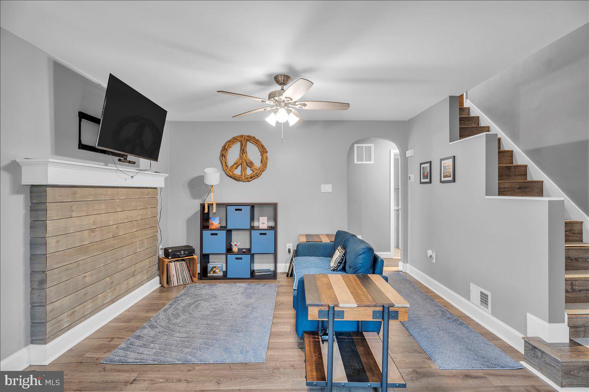 20 West Laurel Road Stratford, NJ 08084 - Photo 7 of 24 a living room with furniture and a flat screen tv