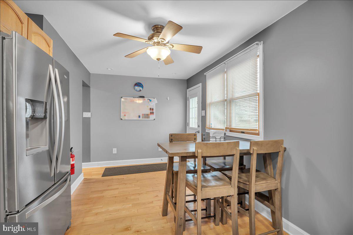 20 West Laurel Road Stratford, NJ 08084 - Photo 9 of 24 a view of a dining room with furniture and window
