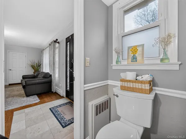 a bathroom with a toilet a sink and a shower