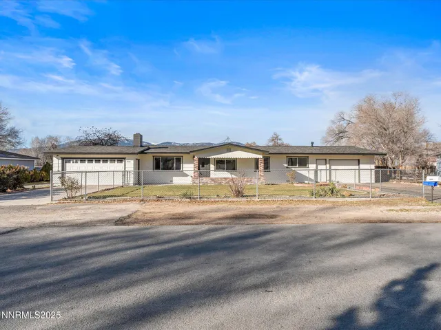 a front view of residential houses with yard