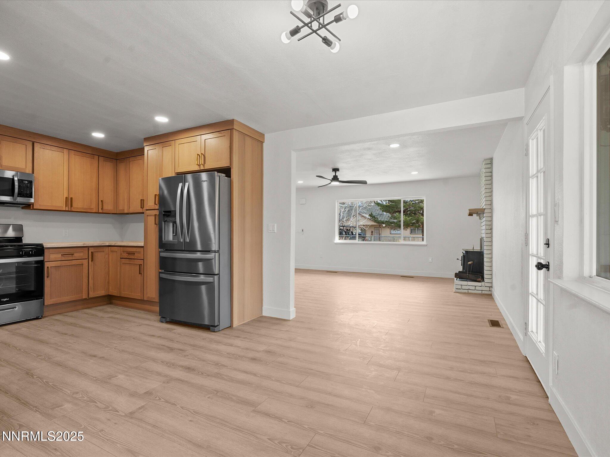 2940 Lukens Lane Carson City, NV 89706 - Photo 12 of 46 a view of kitchen with stainless steel appliances granite countertop a refrigerator and a sink
