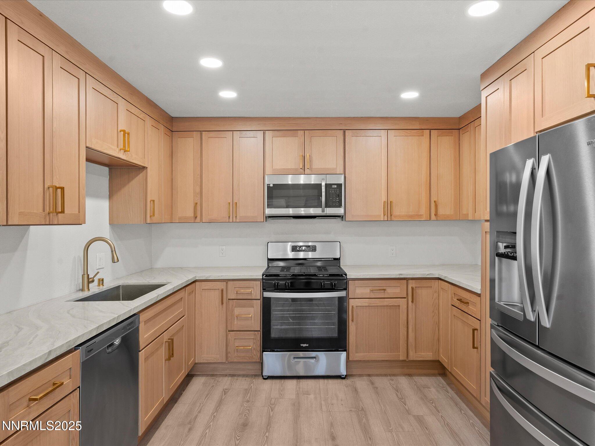 2940 Lukens Lane Carson City, NV 89706 - Photo 15 of 46 a kitchen with a sink stainless steel appliances and cabinets