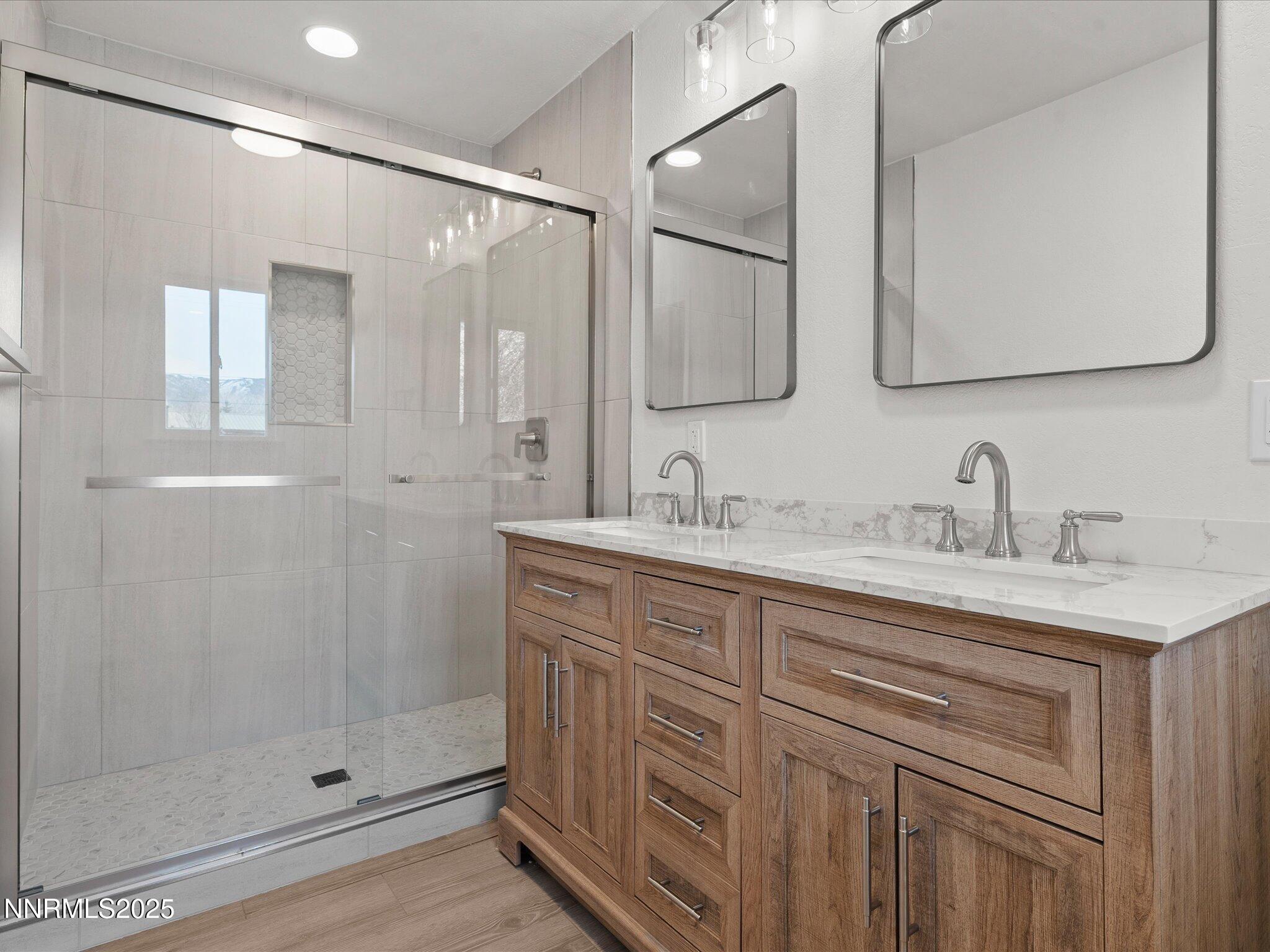 2940 Lukens Lane Carson City, NV 89706 - Photo 25 of 46 a bathroom with a shower sink and mirror