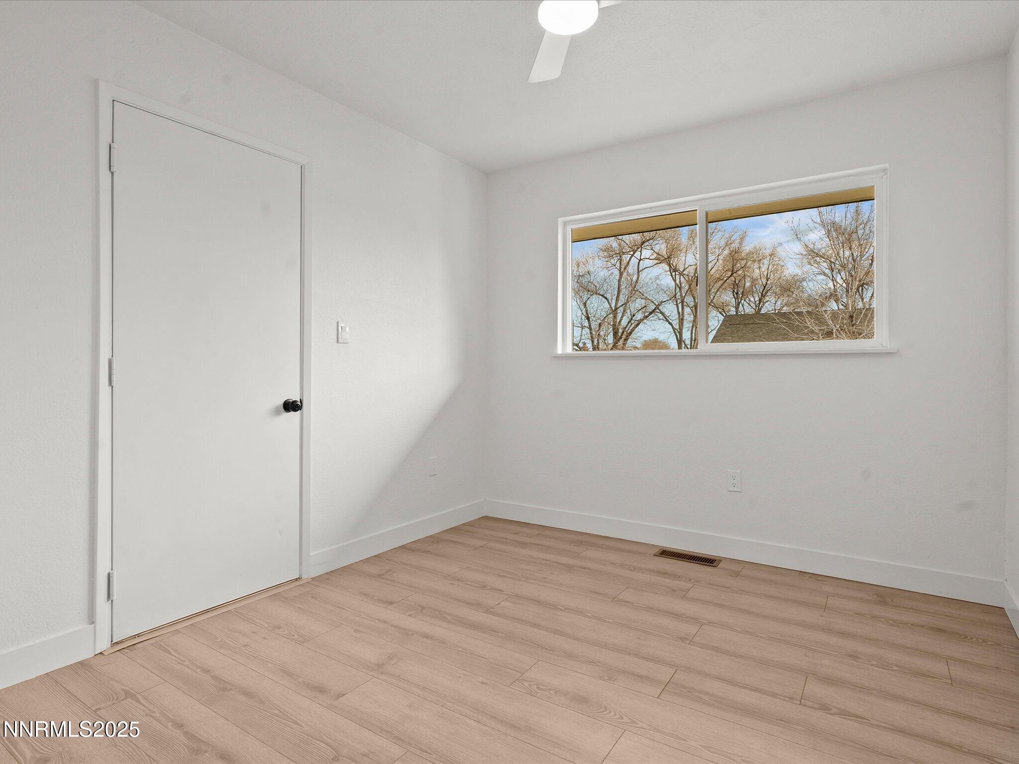 2940 Lukens Lane Carson City, NV 89706 - Photo 27 of 46 wooden floor in an empty room with a window