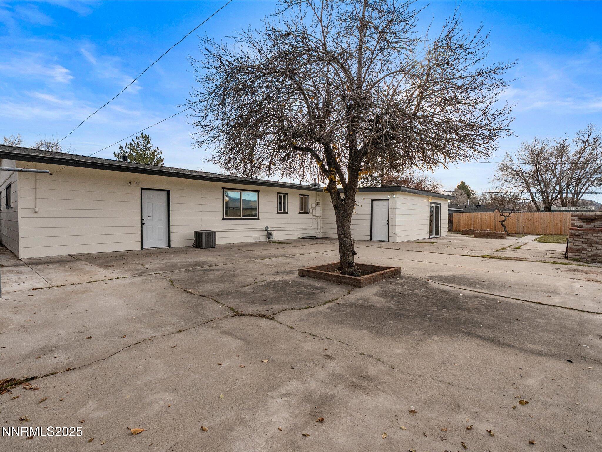 2940 Lukens Lane Carson City, NV 89706 - Photo 35 of 46 a front view of house with garage and trees