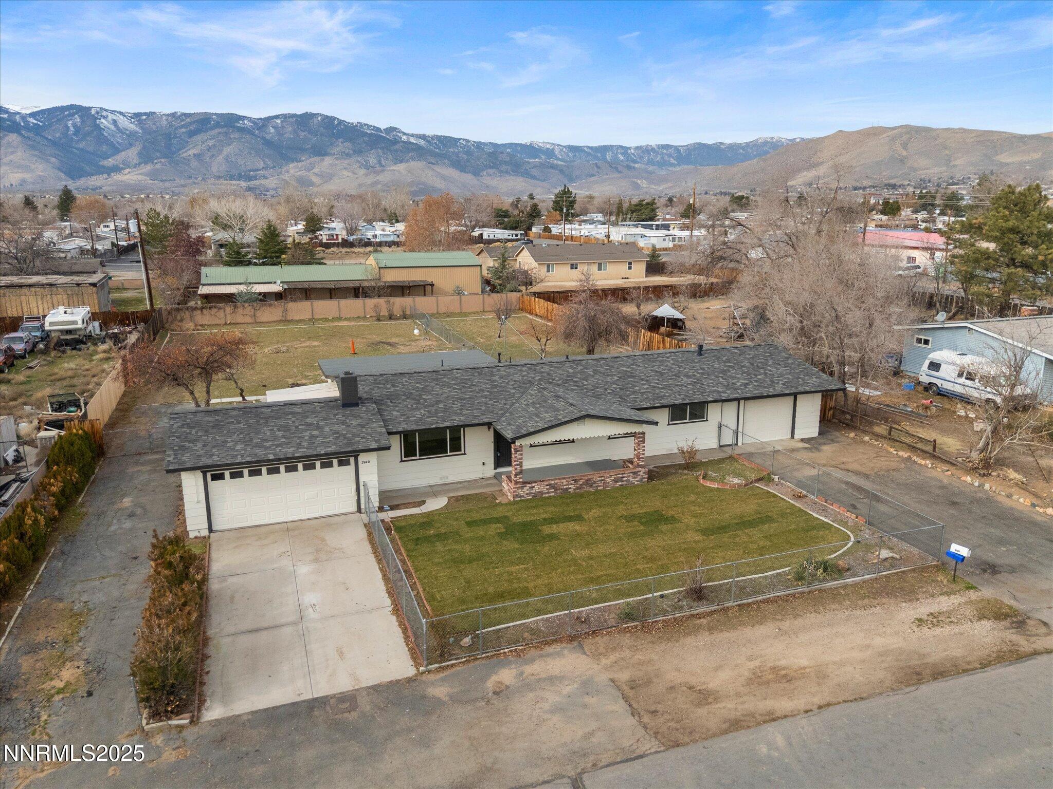 2940 Lukens Lane Carson City, NV 89706 - Photo 6 of 46 an aerial view of residential houses with outdoor space and river