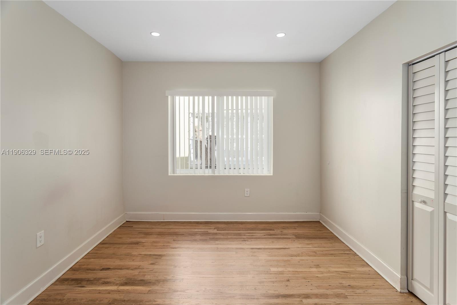 1776 Southwest 11th Terrace Miami, FL 33135 - Photo 18 of 25 a view of empty room with wooden floor and fan