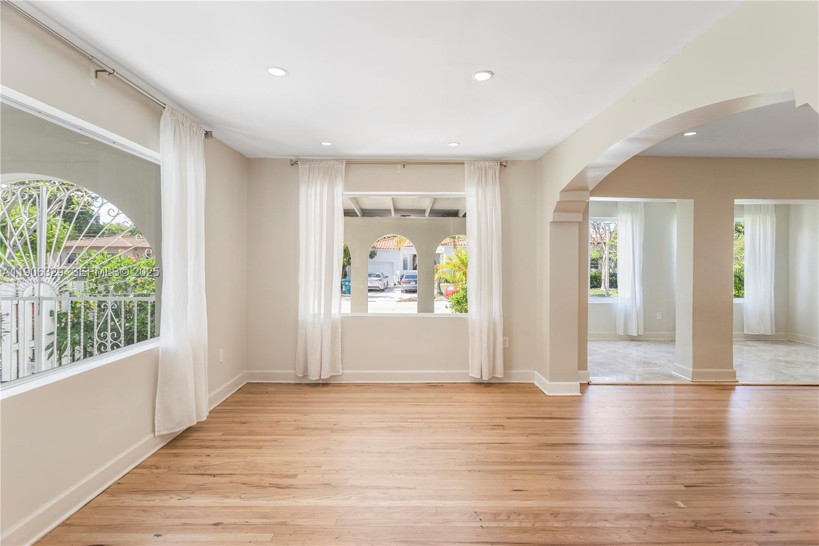 1776 Southwest 11th Terrace Miami, FL 33135 - Photo 5 of 25 a view of hallway with livingroom and wooden floor
