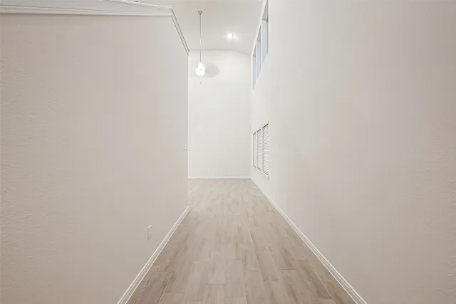 a view of a room with wooden floor