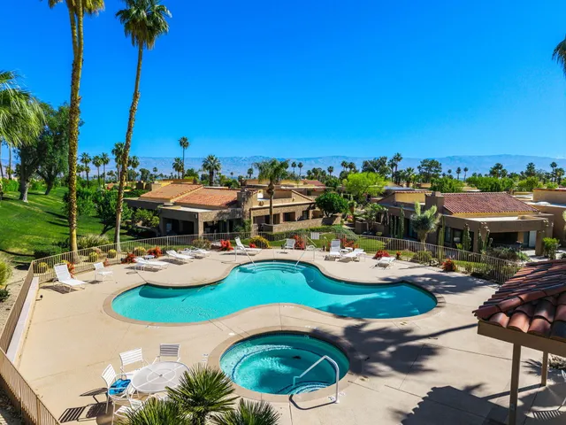 a view of a hallway with closet and a livingroom