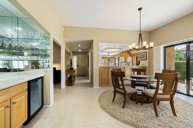 a kitchen with granite countertop cabinets stainless steel appliances and a counter space