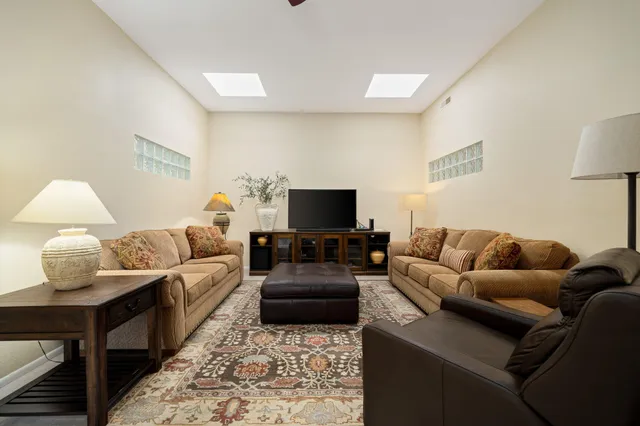 a bathroom with a window and a shower