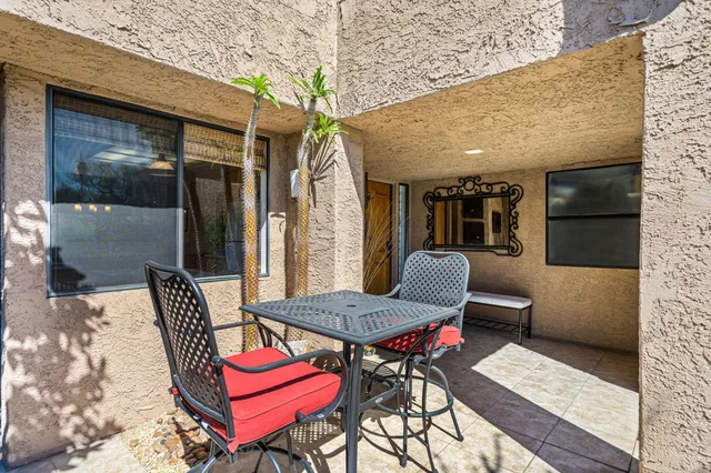 a bedroom with furniture and a window
