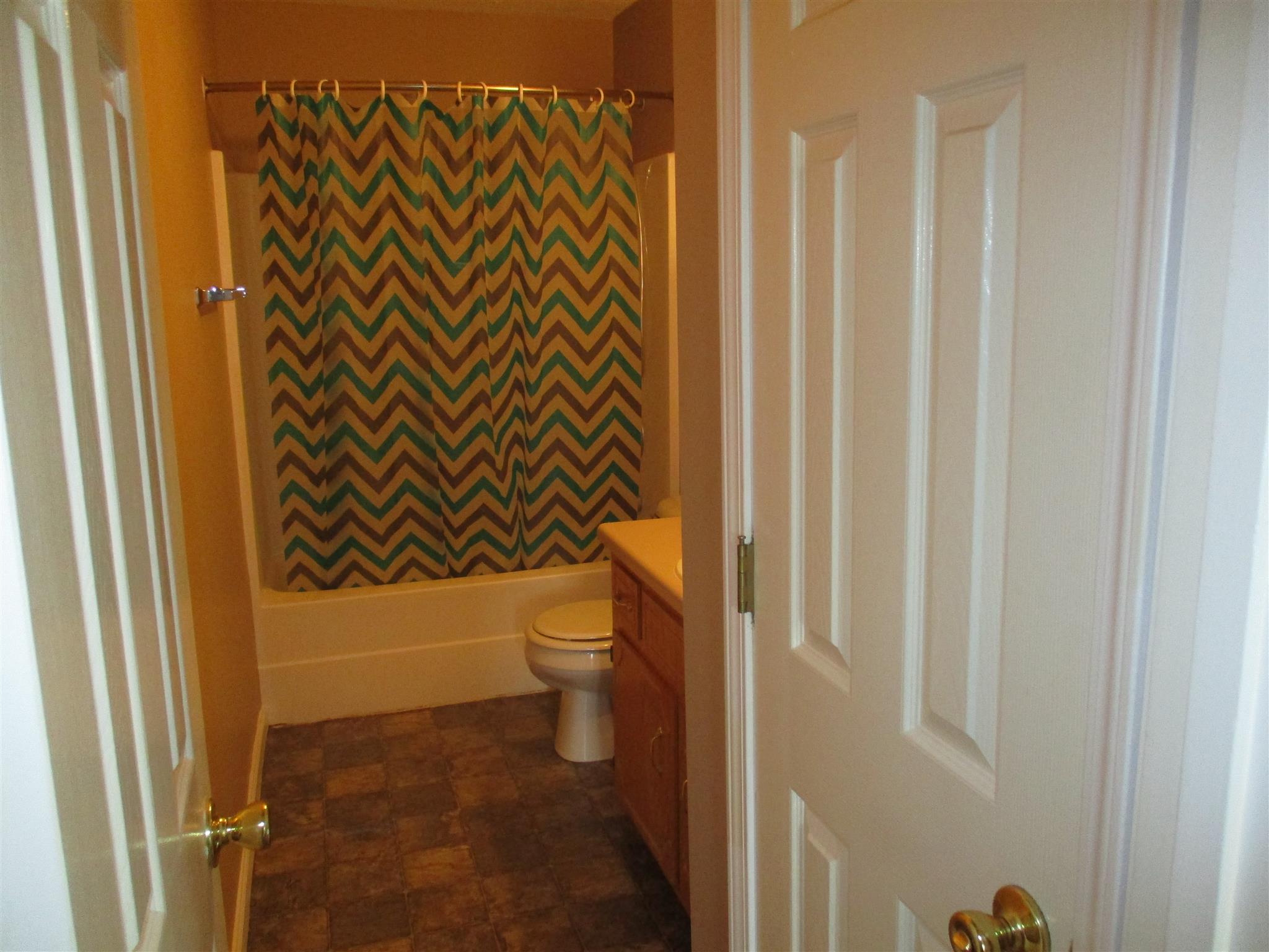 1051 Shadow Ridge Avenue Oak Grove, KY 42262 - Photo 11 of 20 a bathroom with a toilet and shower
