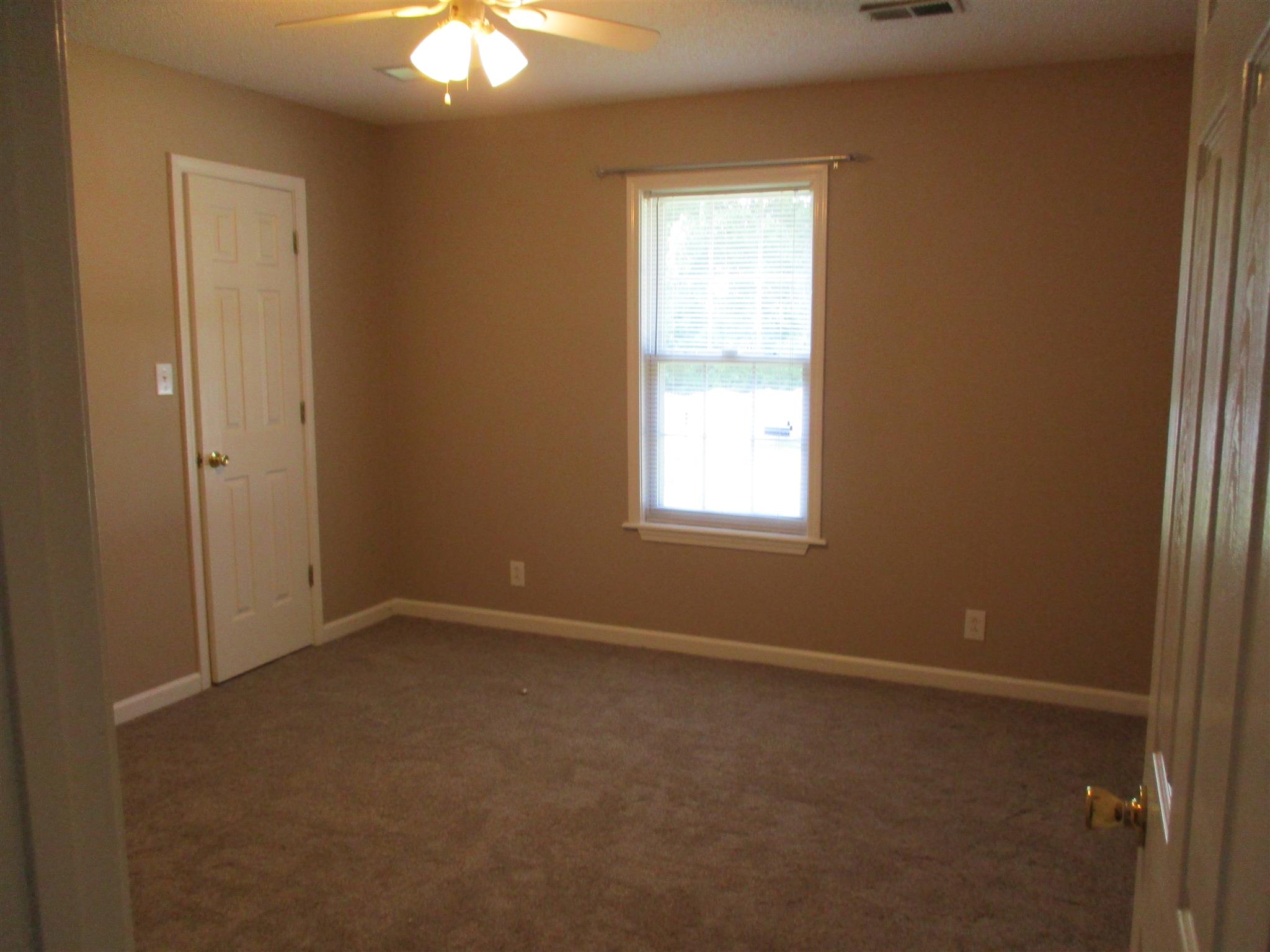 1051 Shadow Ridge Avenue Oak Grove, KY 42262 - Photo 17 of 20 an empty room with windows and fan