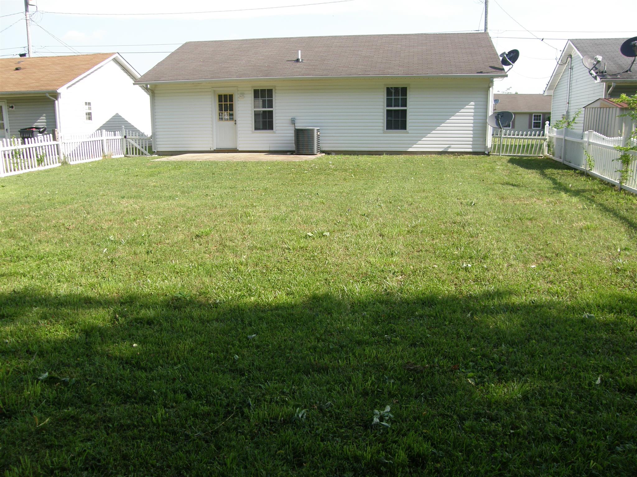 1051 Shadow Ridge Avenue Oak Grove, KY 42262 - Photo 20 of 20 a front view of a house with a garden
