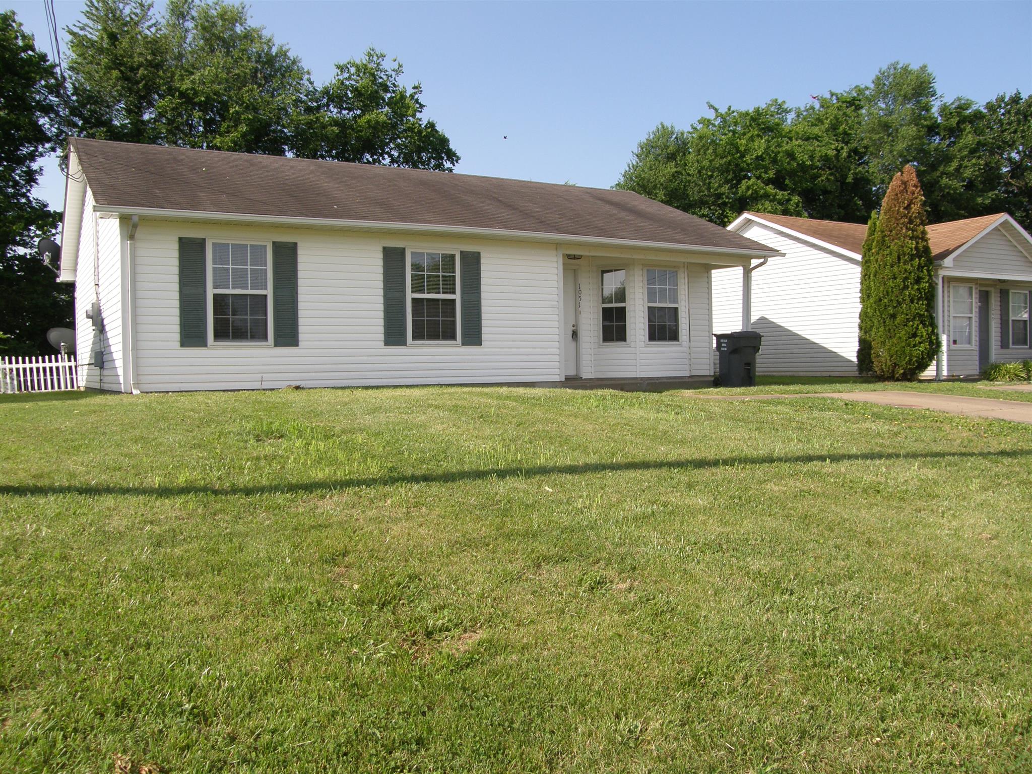 1051 Shadow Ridge Avenue Oak Grove, KY 42262 - Photo 3 of 20 a front view of a house with a garden