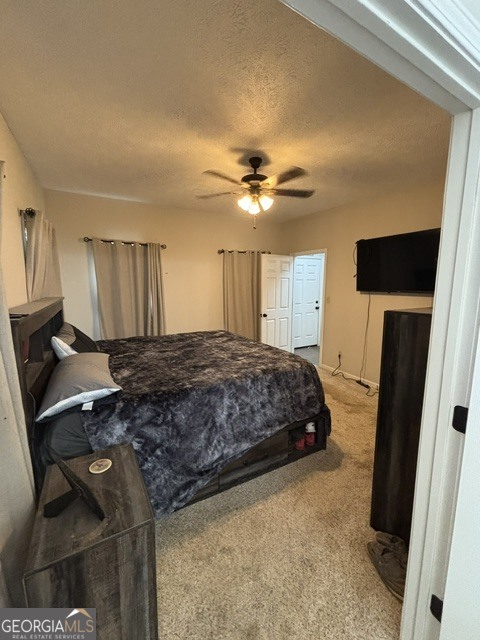 771 Hamilton Road Concord, GA 30206 - Photo 17 of 30 a spacious bedroom with a bed and a chandelier
