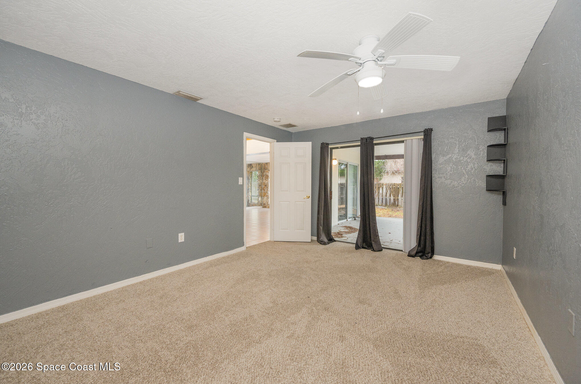 696 Las Palmas Way Melbourne, FL 32940 - Photo 11 of 21 a view of an empty room with a window