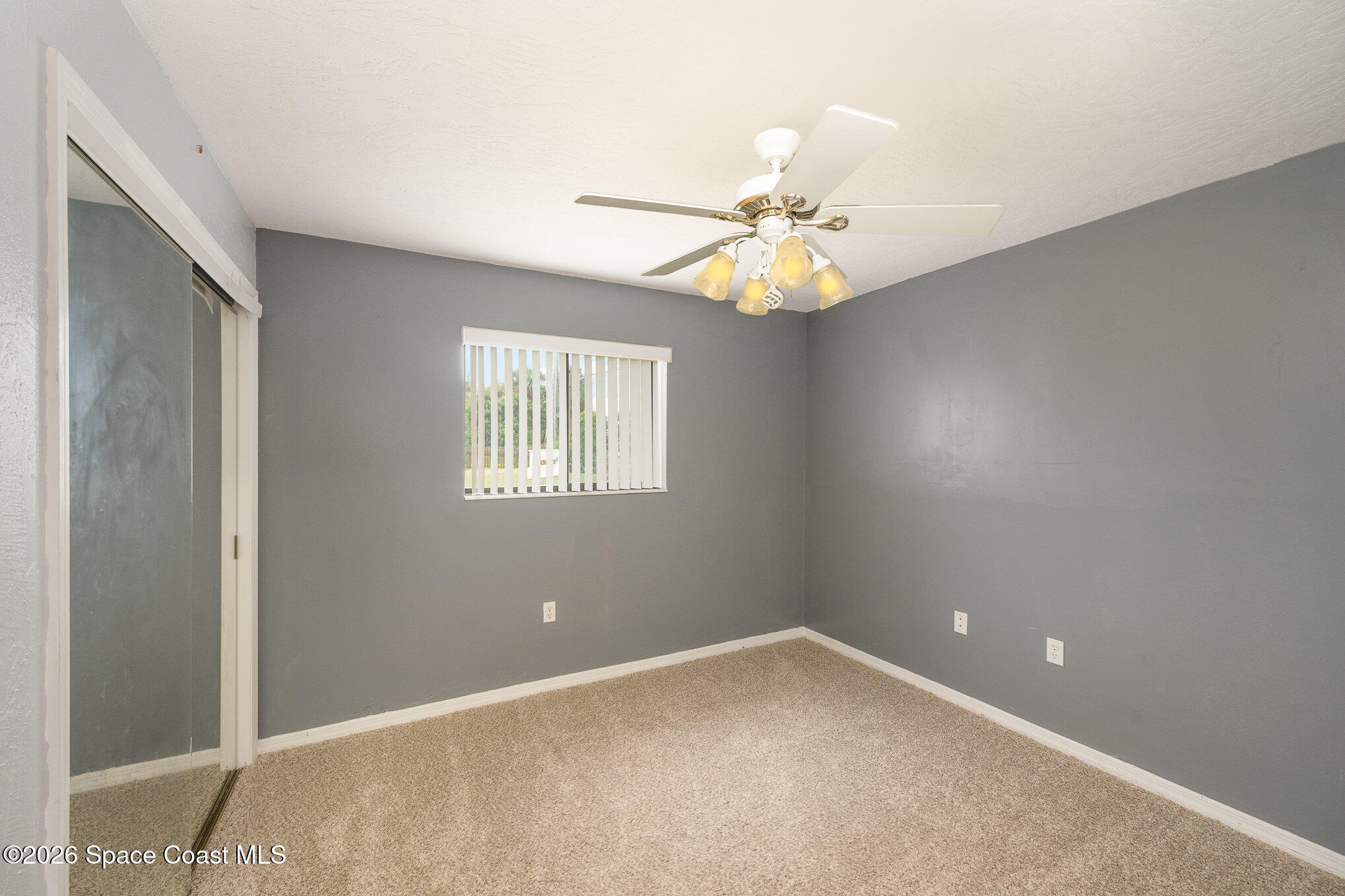 696 Las Palmas Way Melbourne, FL 32940 - Photo 15 of 21 a view of an empty room with a window
