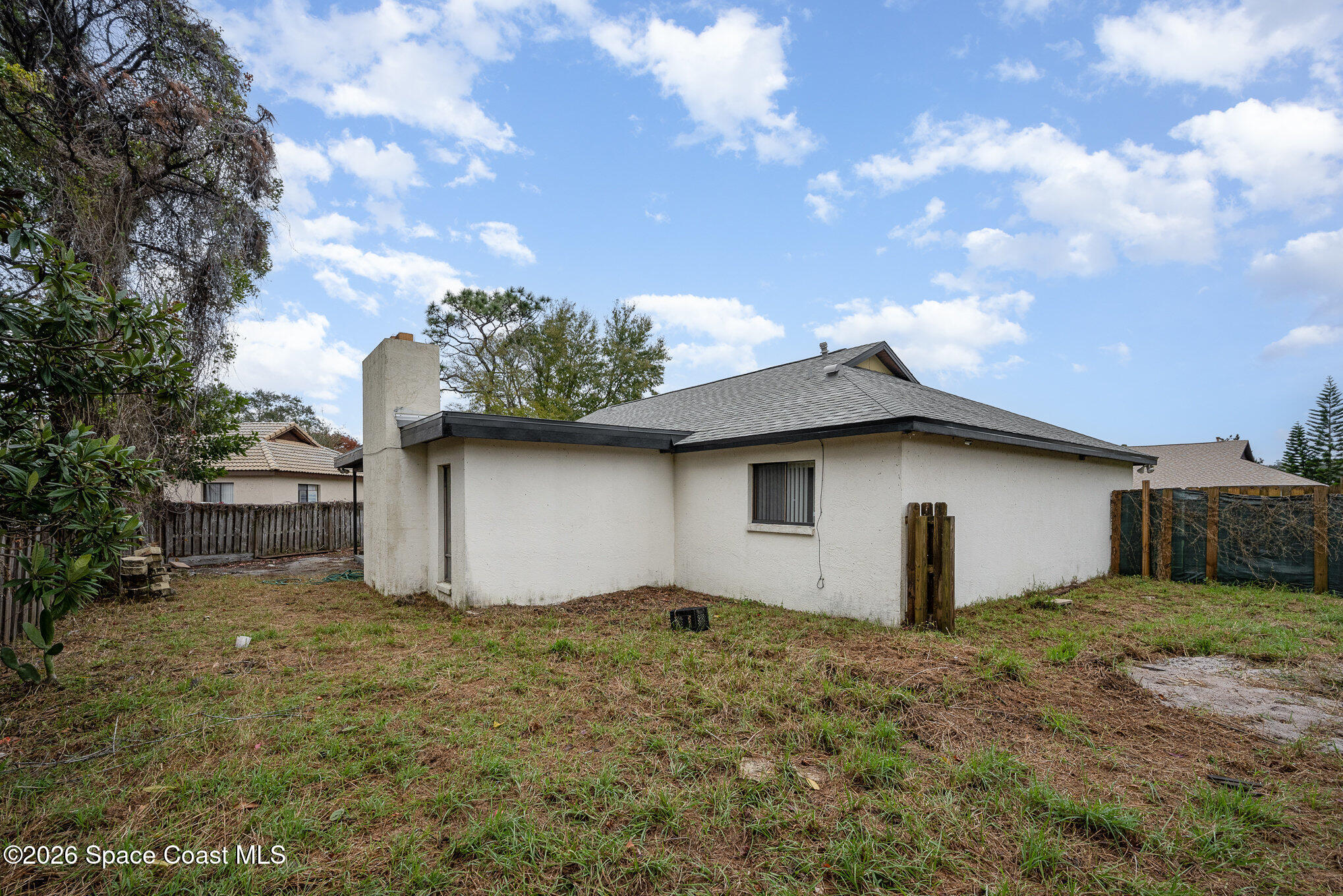 696 Las Palmas Way Melbourne, FL 32940 - Photo 21 of 21 a house with garden in front of it