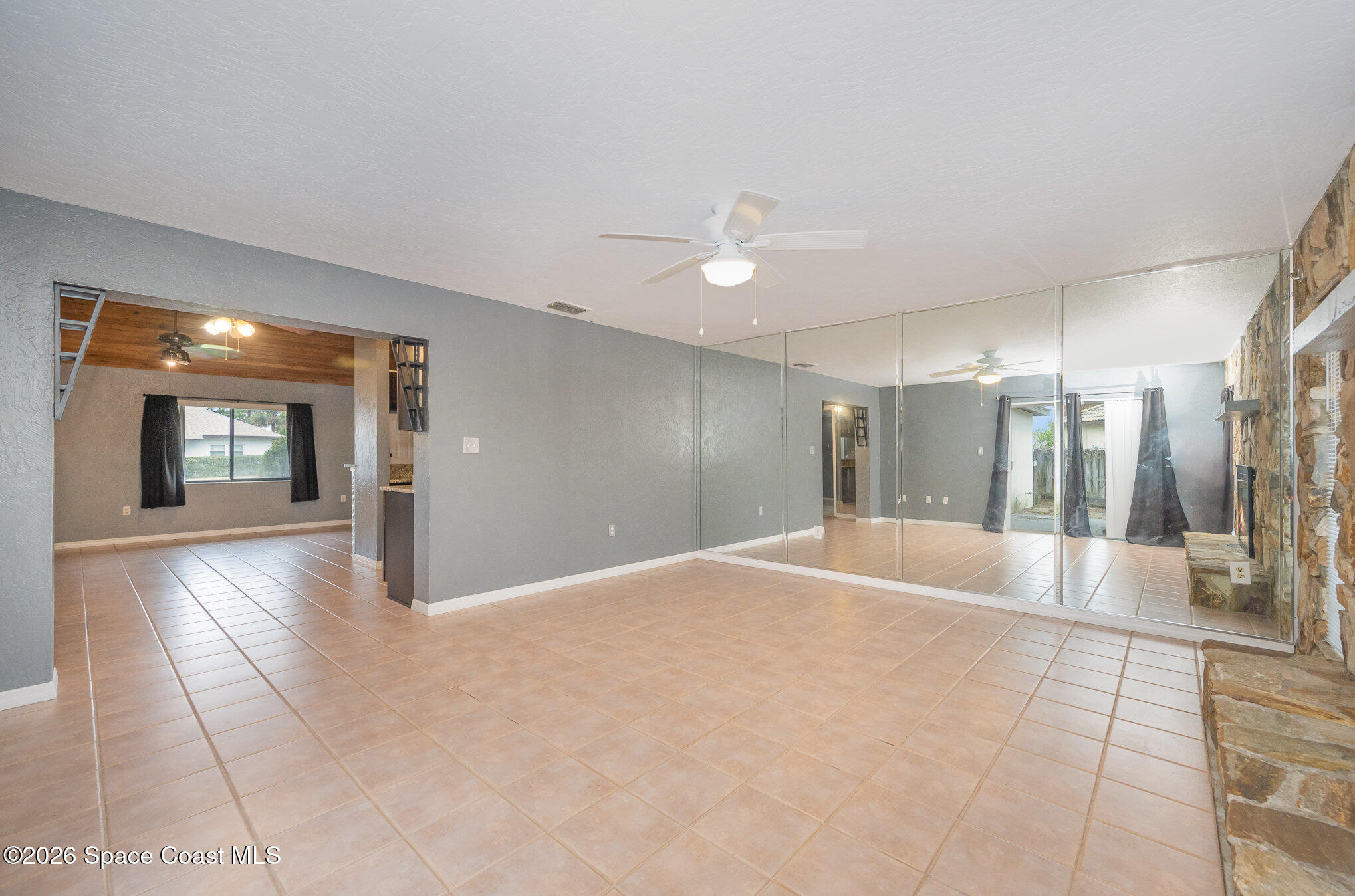 696 Las Palmas Way Melbourne, FL 32940 - Photo 3 of 21 a view of an empty room with closet and a window