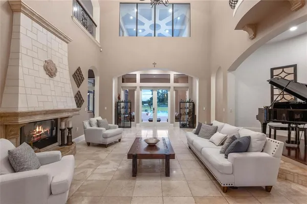 a living room with furniture and a fireplace