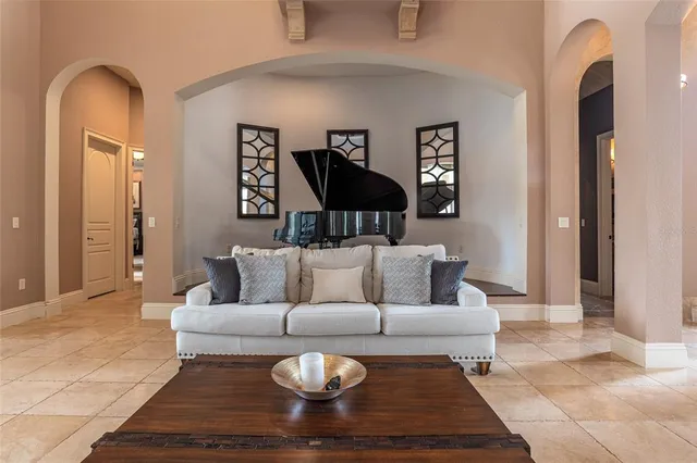 a living room with furniture a rug and a fireplace