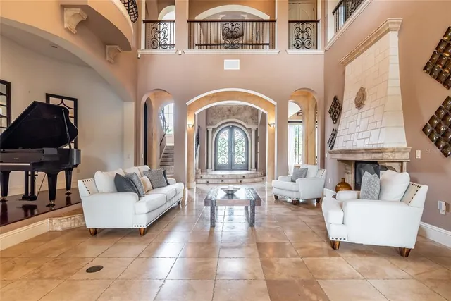 a view of a dining room with furniture and chandelier