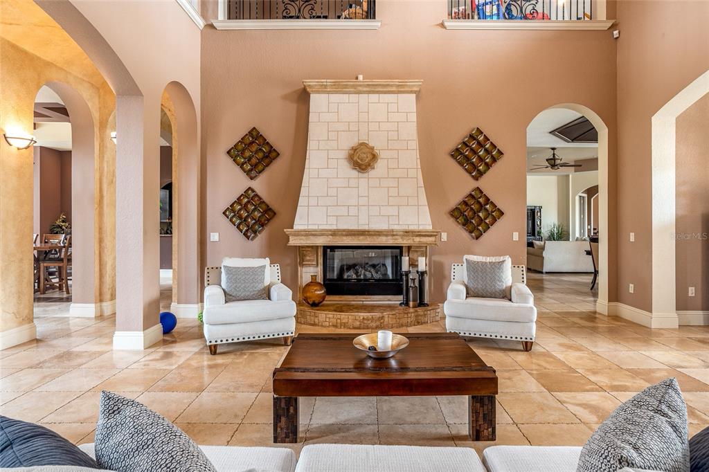 5251 Carson Street St. Cloud, FL 34771 - Photo 15 of 60 a living room with furniture a rug and a fireplace