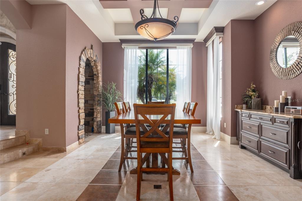5251 Carson Street St. Cloud, FL 34771 - Photo 16 of 60 a view of a dining room with furniture and chandelier
