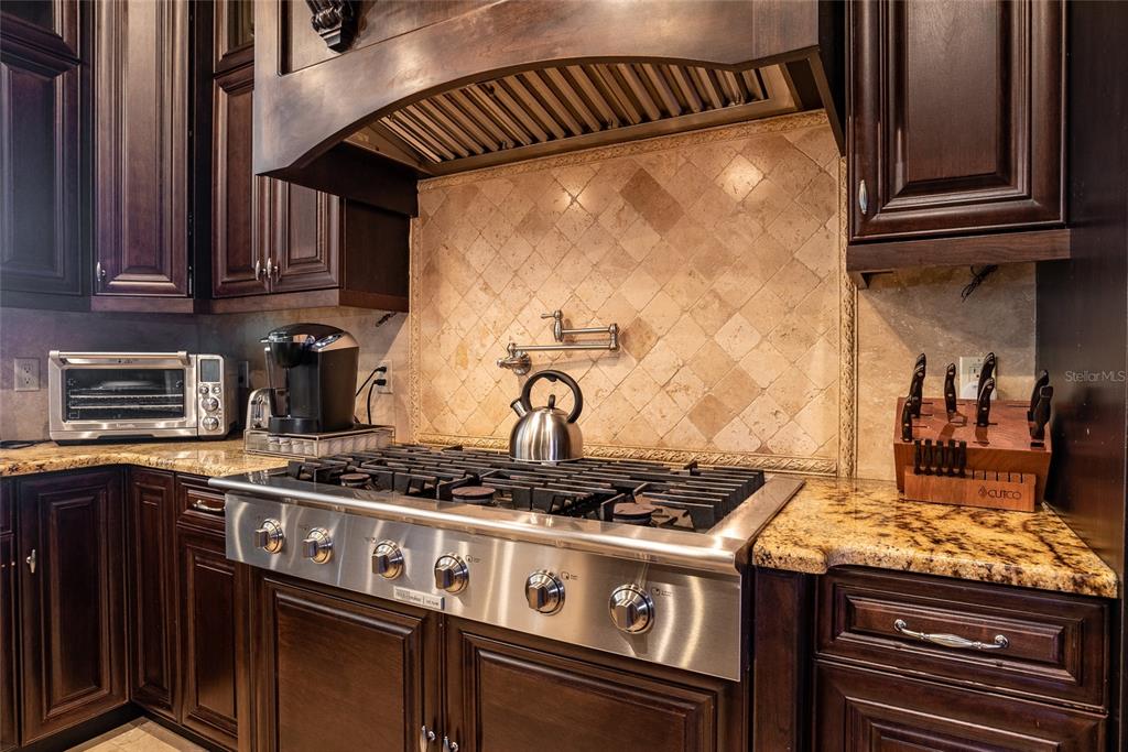 5251 Carson Street St. Cloud, FL 34771 - Photo 21 of 60 a kitchen with granite countertop a stove and a sink