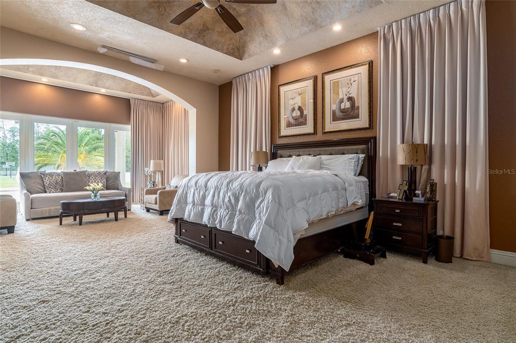 5251 Carson Street St. Cloud, FL 34771 - Photo 29 of 60 a bedroom with a bed and a large window