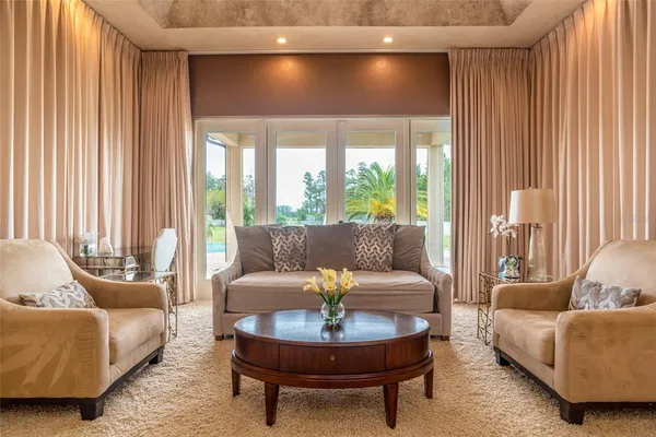 a bedroom with a bed couch and a window