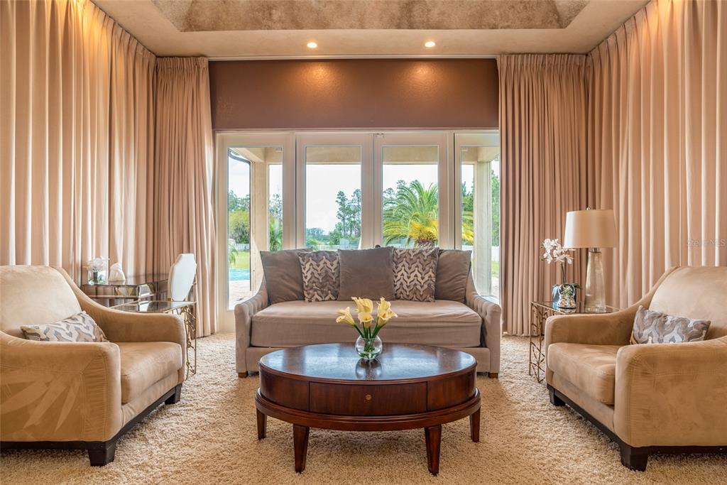 5251 Carson Street St. Cloud, FL 34771 - Photo 31 of 60 a living room with furniture and a large window