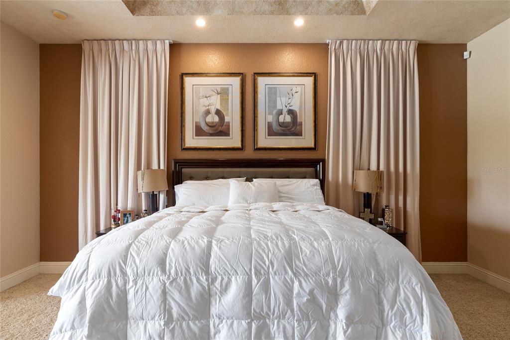 5251 Carson Street St. Cloud, FL 34771 - Photo 32 of 60 a bed sitting in a bedroom next to a window