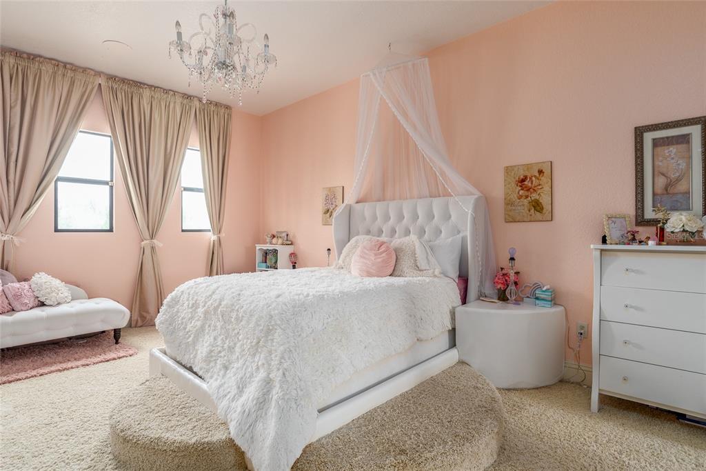 5251 Carson Street St. Cloud, FL 34771 - Photo 45 of 60 a bedroom with a bed and a window