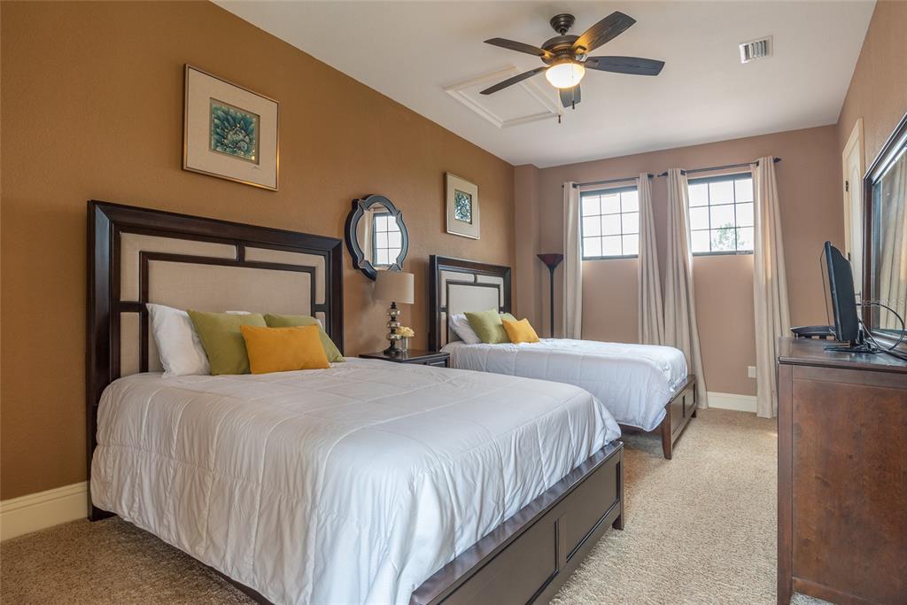 5251 Carson Street St. Cloud, FL 34771 - Photo 47 of 60 a bedroom with a bed and a chandelier