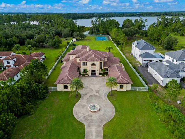 an aerial view of a house with garden space and street view