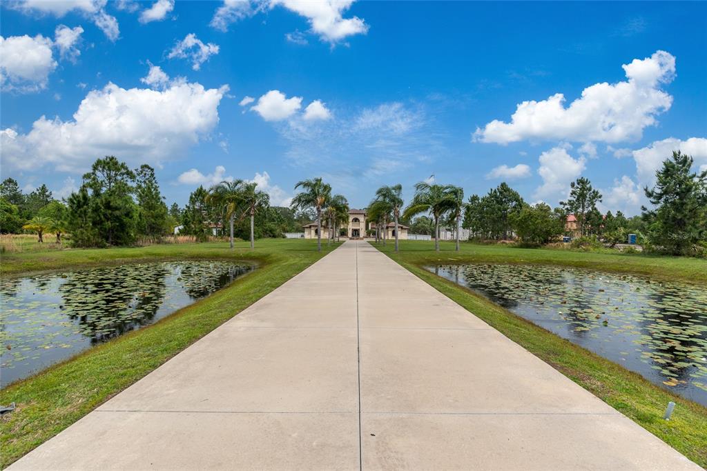5251 Carson Street St. Cloud, FL 34771 - Photo 7 of 60 a view of a lake with a yard