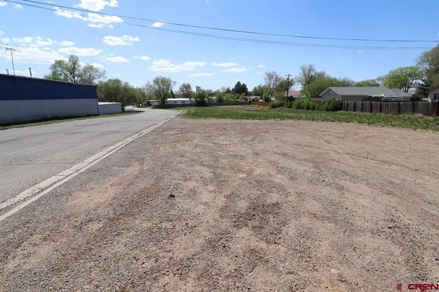 a view of a patio with a yard
