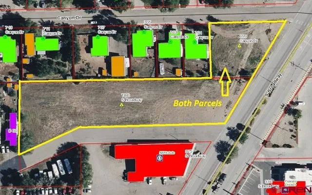 an aerial view of a house with a swimming pool