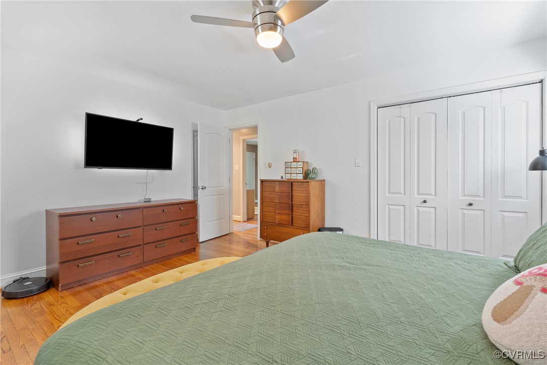 5018 Grassmere Road Richmond, VA 23234 - Photo 15 of 34 Bedroom featuring light wood-type flooring, a clos