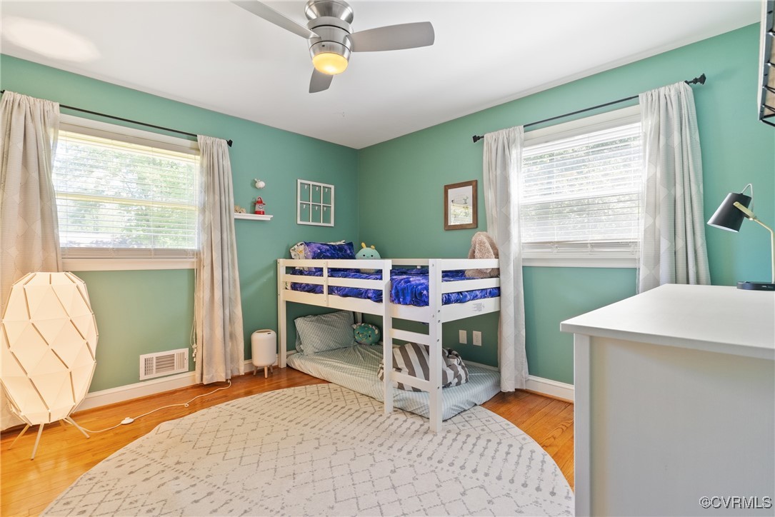 5018 Grassmere Road Richmond, VA 23234 - Photo 17 of 34 Bedroom with multiple windows, wood finished floor