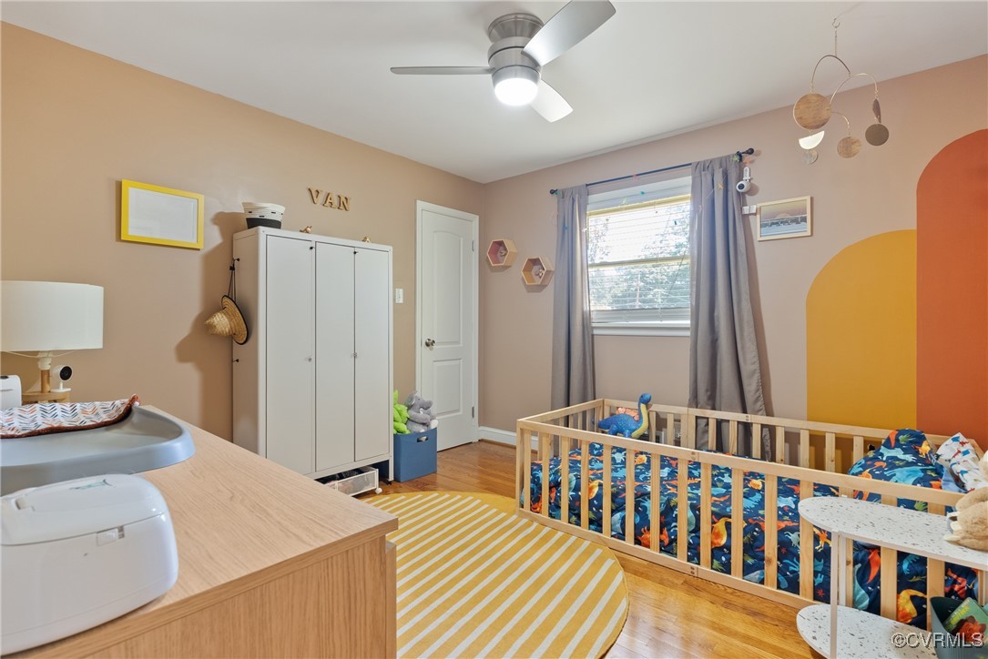 5018 Grassmere Road Richmond, VA 23234 - Photo 19 of 34 Bedroom with wood finished floors, arched walkways