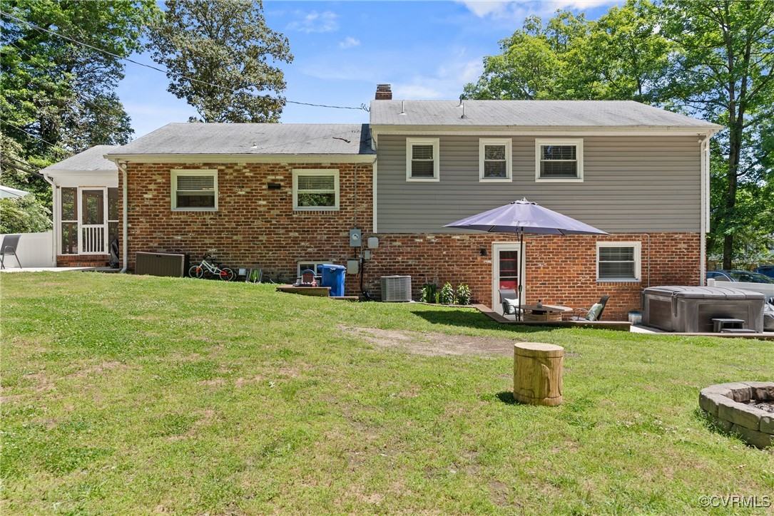 5018 Grassmere Road Richmond, VA 23234 - Photo 31 of 34 Back of property featuring a hot tub, central air