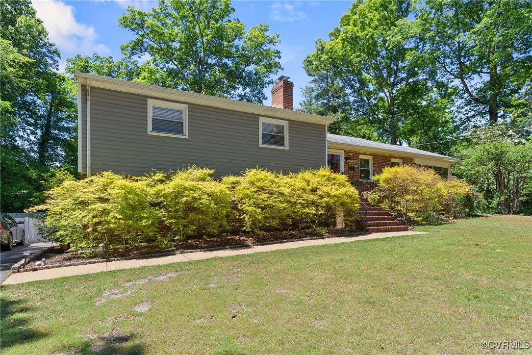 5018 Grassmere Road Richmond, VA 23234 - Photo 34 of 34 View of front facade featuring a chimney, a front