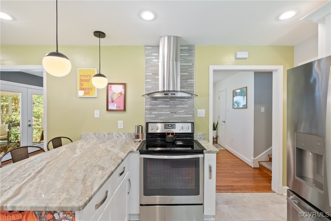 5018 Grassmere Road Richmond, VA 23234 - Photo 10 of 34 Kitchen with stainless steel appliances, wall chim