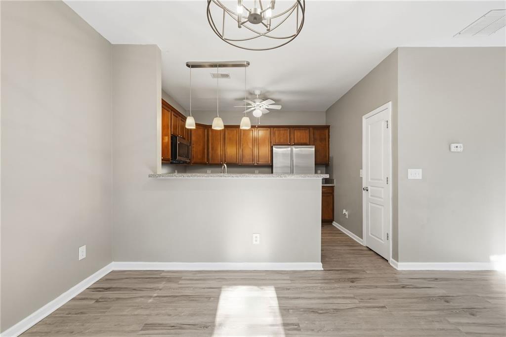 331 Oakview Way Canton, GA 30114 - Photo 13 of 42 a view of a room with wooden floor and windows