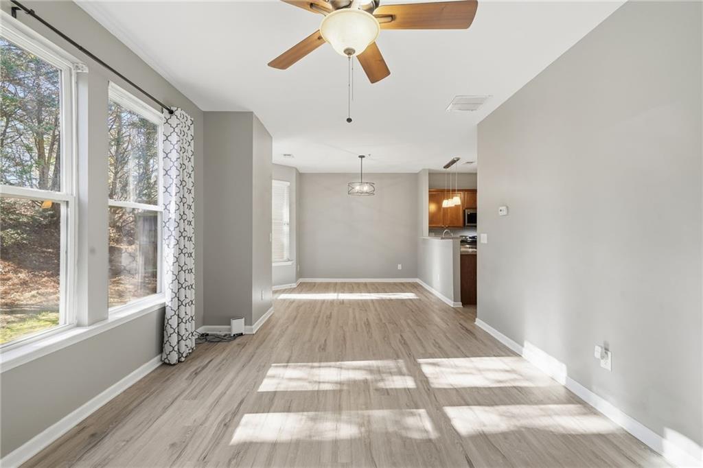 331 Oakview Way Canton, GA 30114 - Photo 17 of 42 a view of empty room with wooden floor and fan